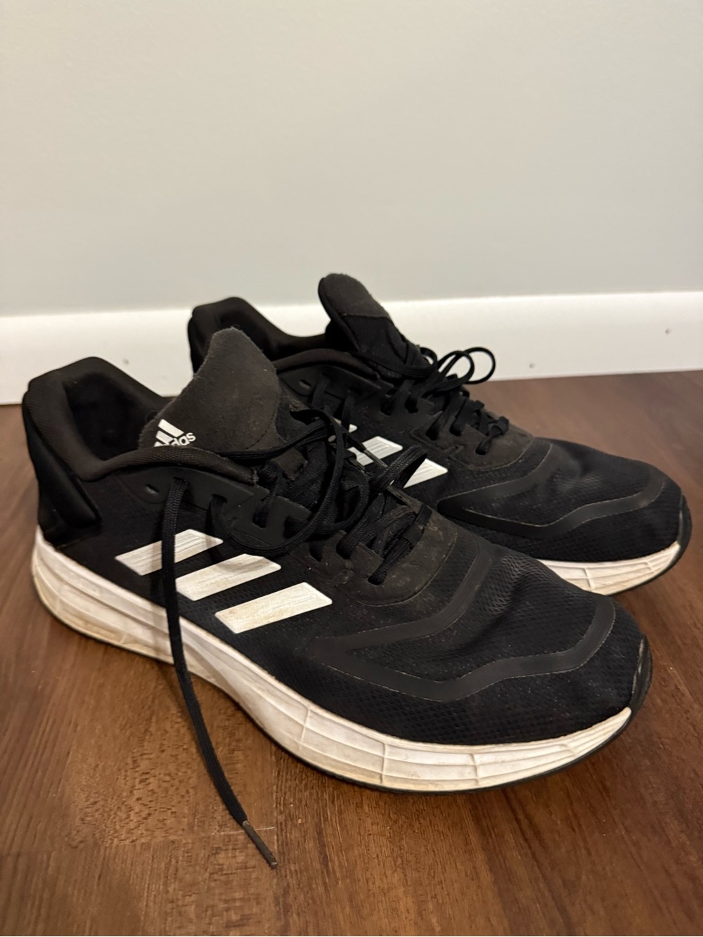adidas Men’s Black Athletic Shoes with White Stripes